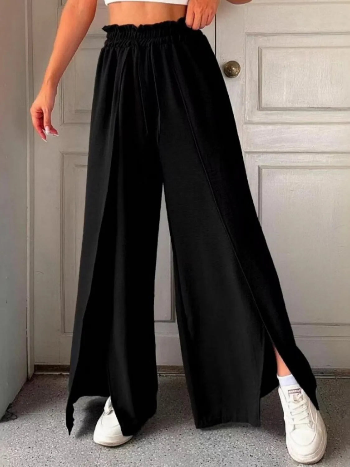 Slit wide leg pants with frill.