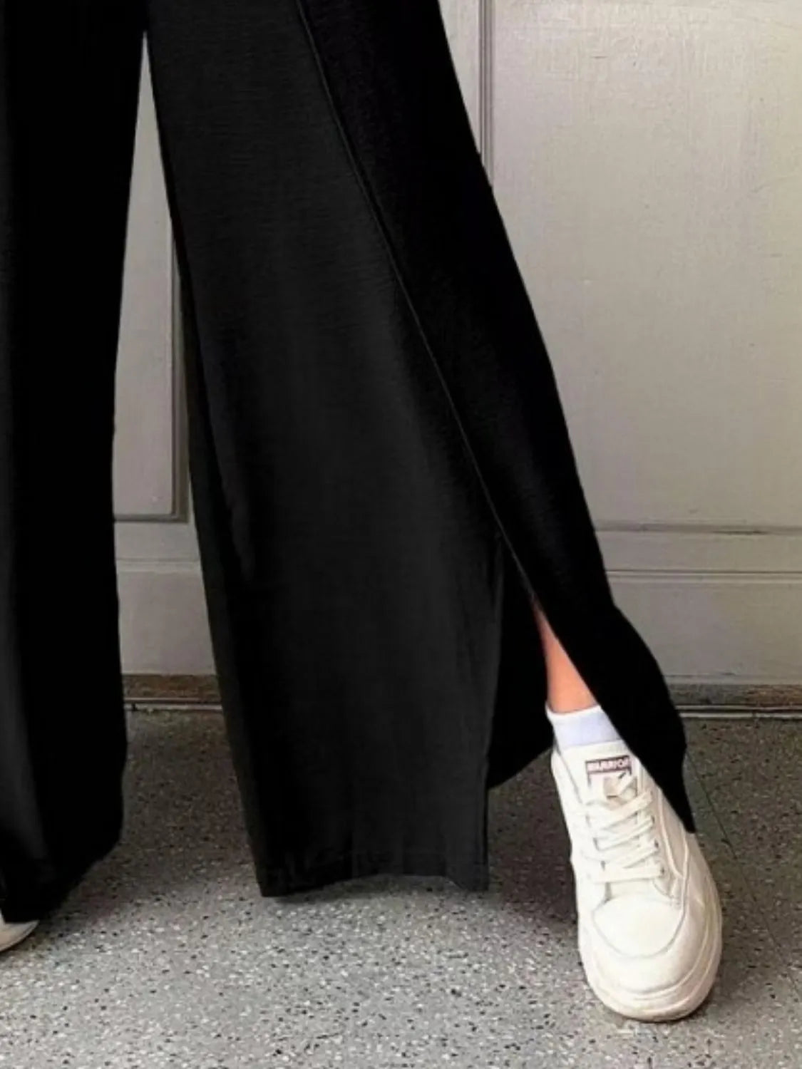 Slit wide leg pants with frill.