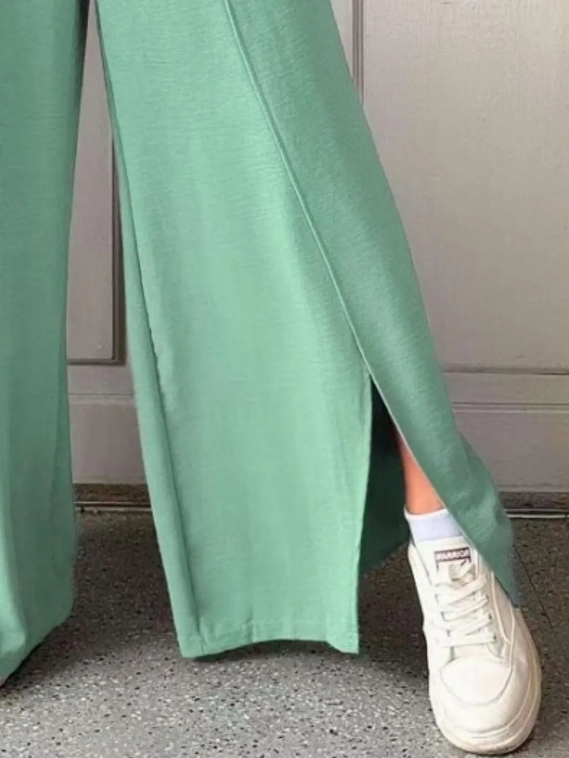 Slit wide leg pants with frill.