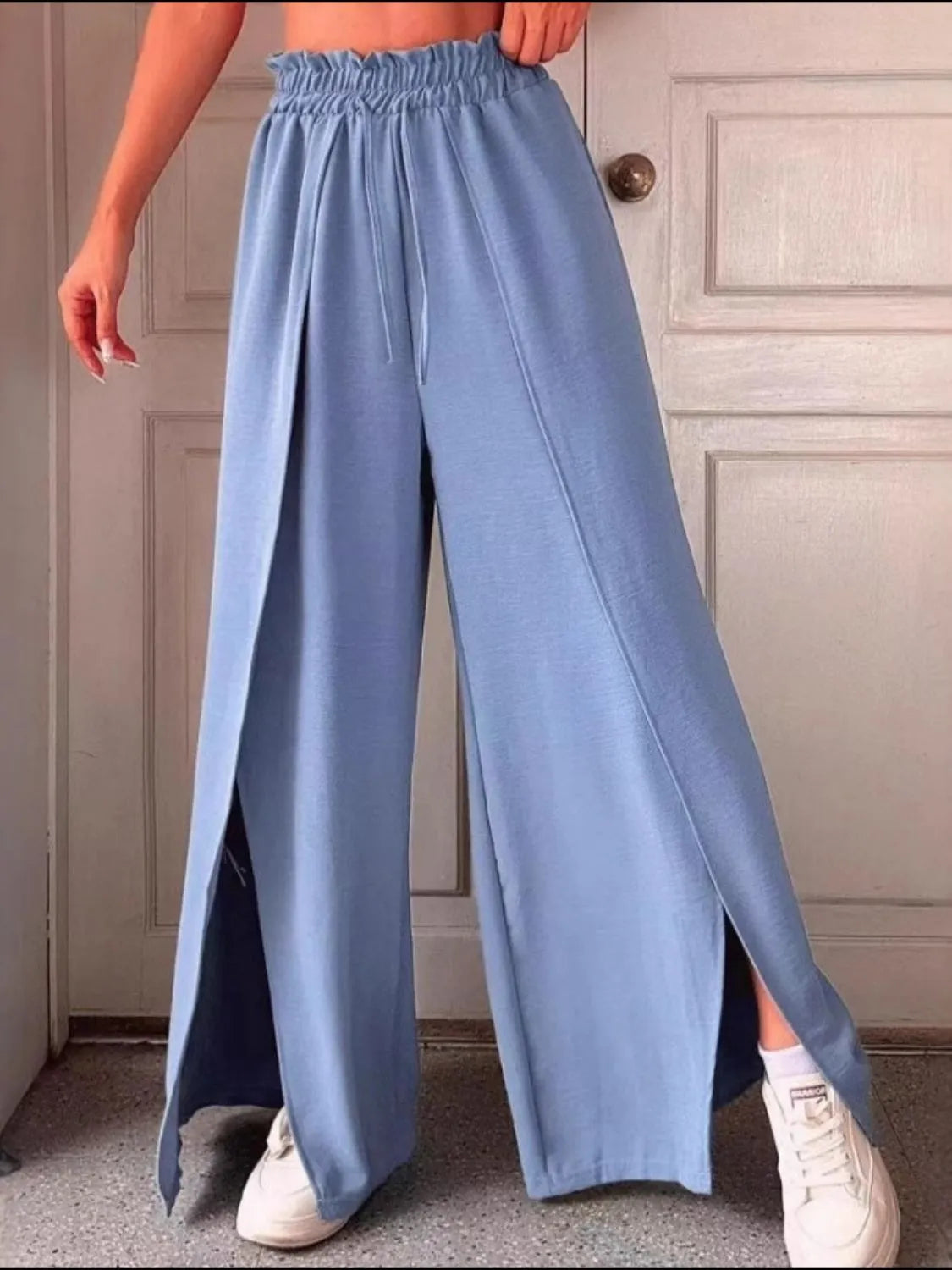 Slit wide leg pants with frill.