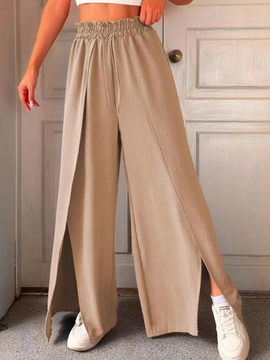 Slit wide leg pants with frill.