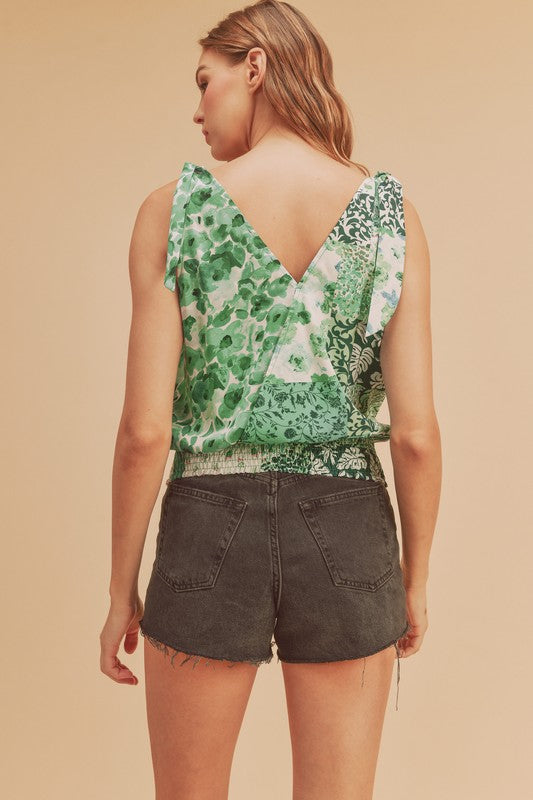 Smocked hem printed surplice tank, opaque and slightly stretchy.