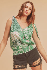 Smocked hem printed surplice tank, opaque and slightly stretchy.