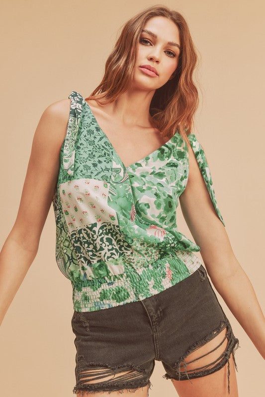 Smocked hem printed surplice tank, opaque and slightly stretchy.