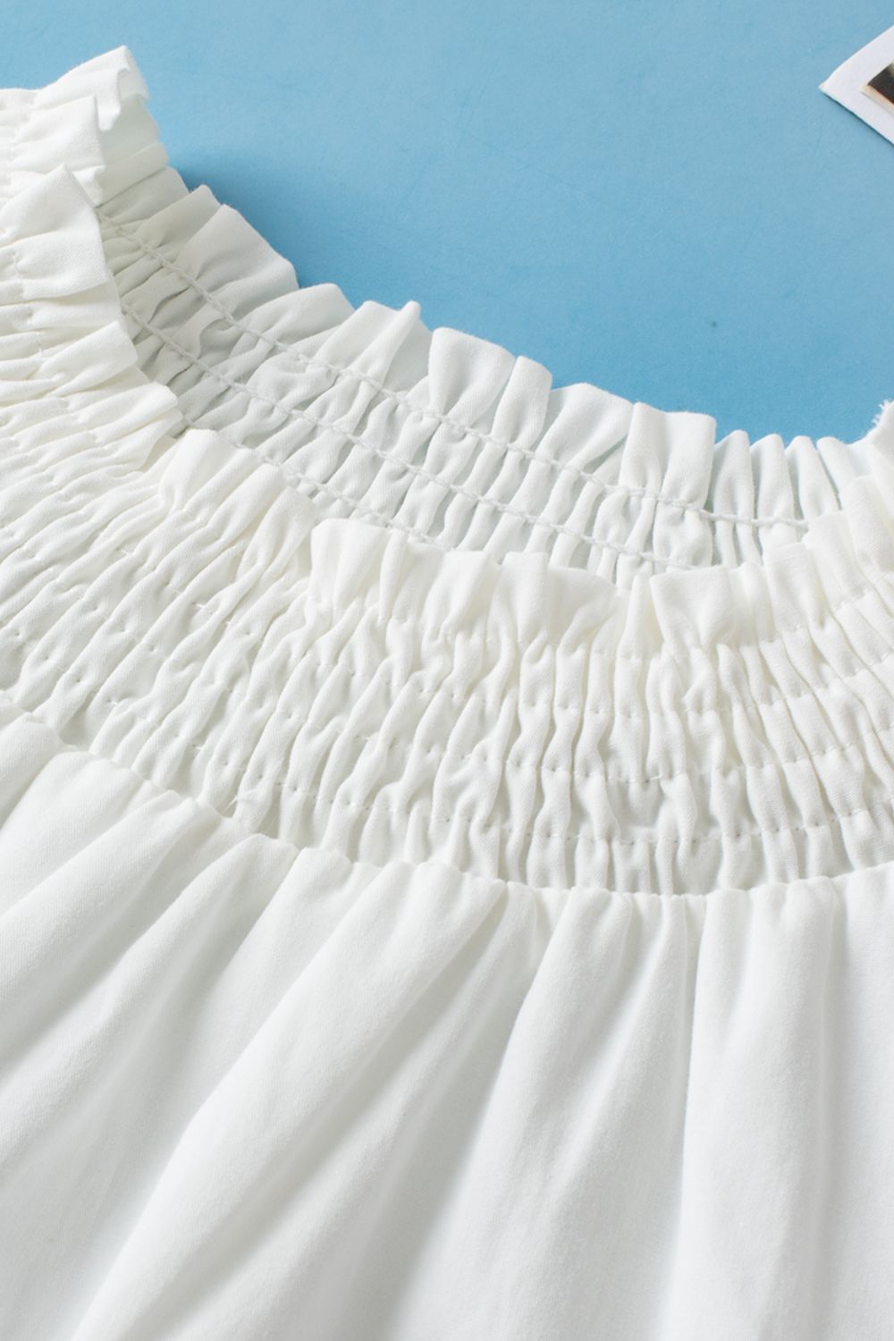 Smocked Neck Embroidered Puff Sleeve Top.