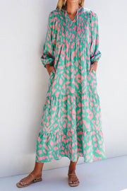 Smocked Printed Tie Neck Long Sleeve Dress.