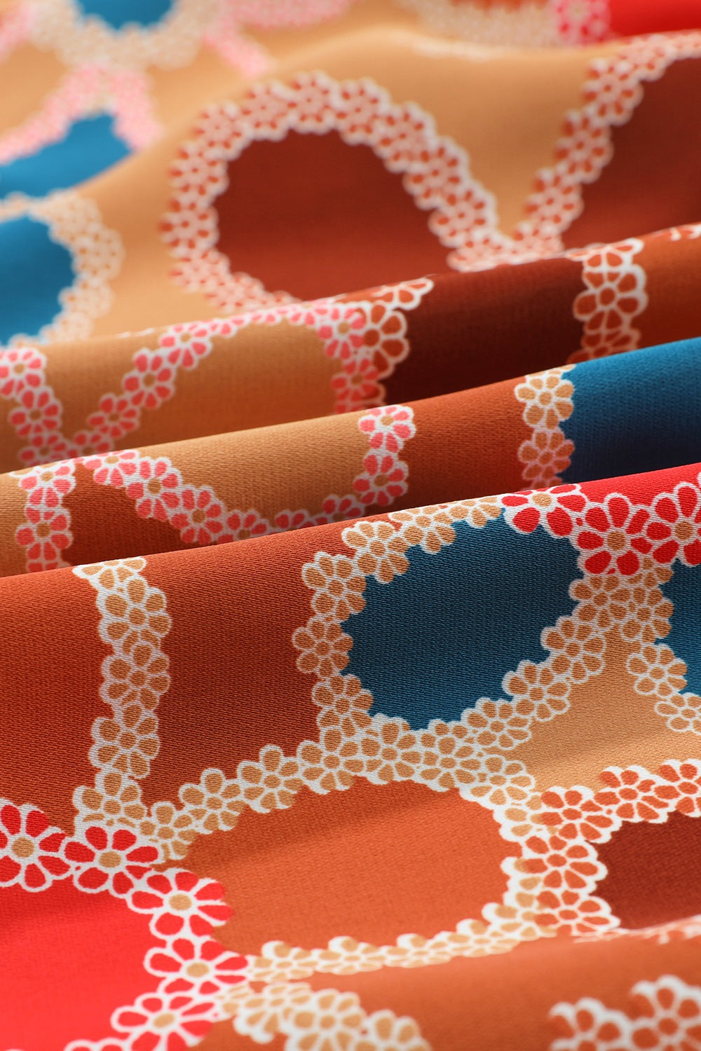 Smocked Printed V-Neck Half Sleeve Blouse.