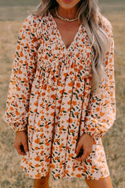 Smocked Printed V-Neck Long Sleeve Dress.
