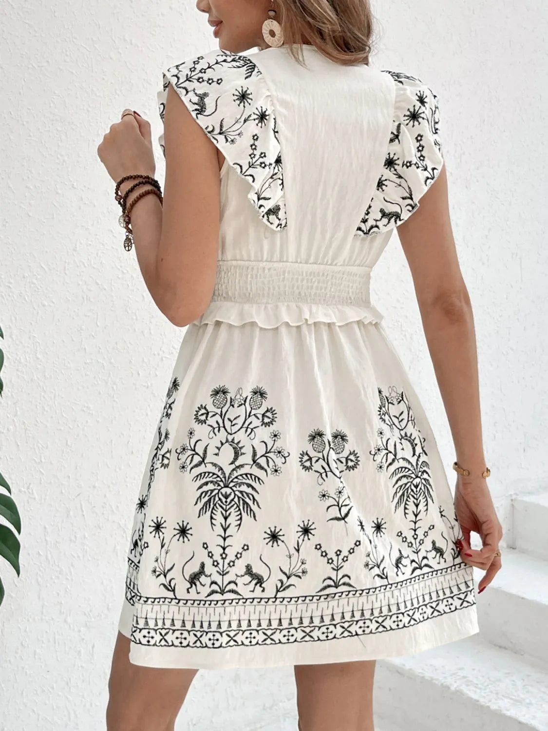 Smocked Ruffled Cap Sleeve Mini Dress.