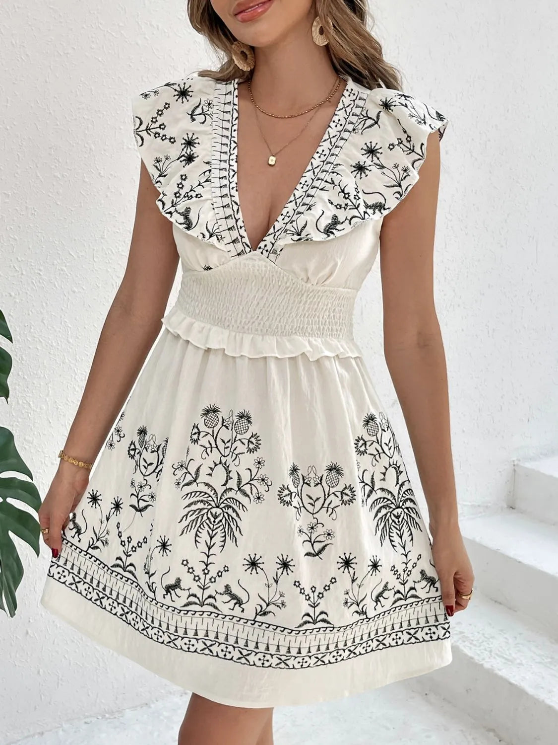 Smocked Ruffled Cap Sleeve Mini Dress.