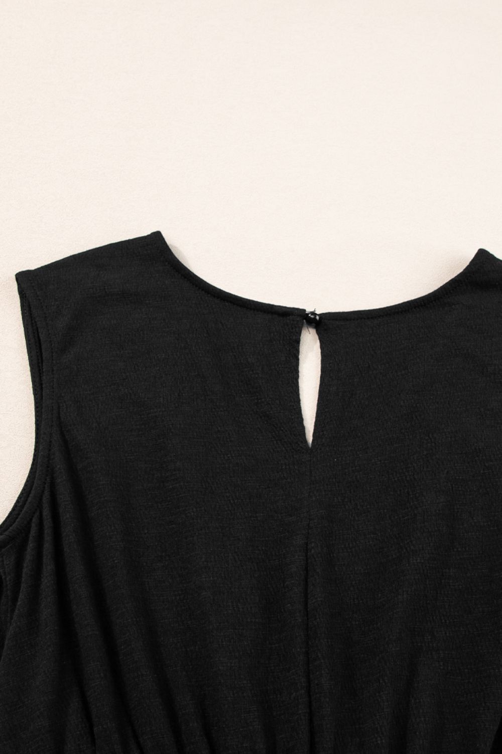 Smocked Sleeveless V Neck Jumpsuit with Pockets.