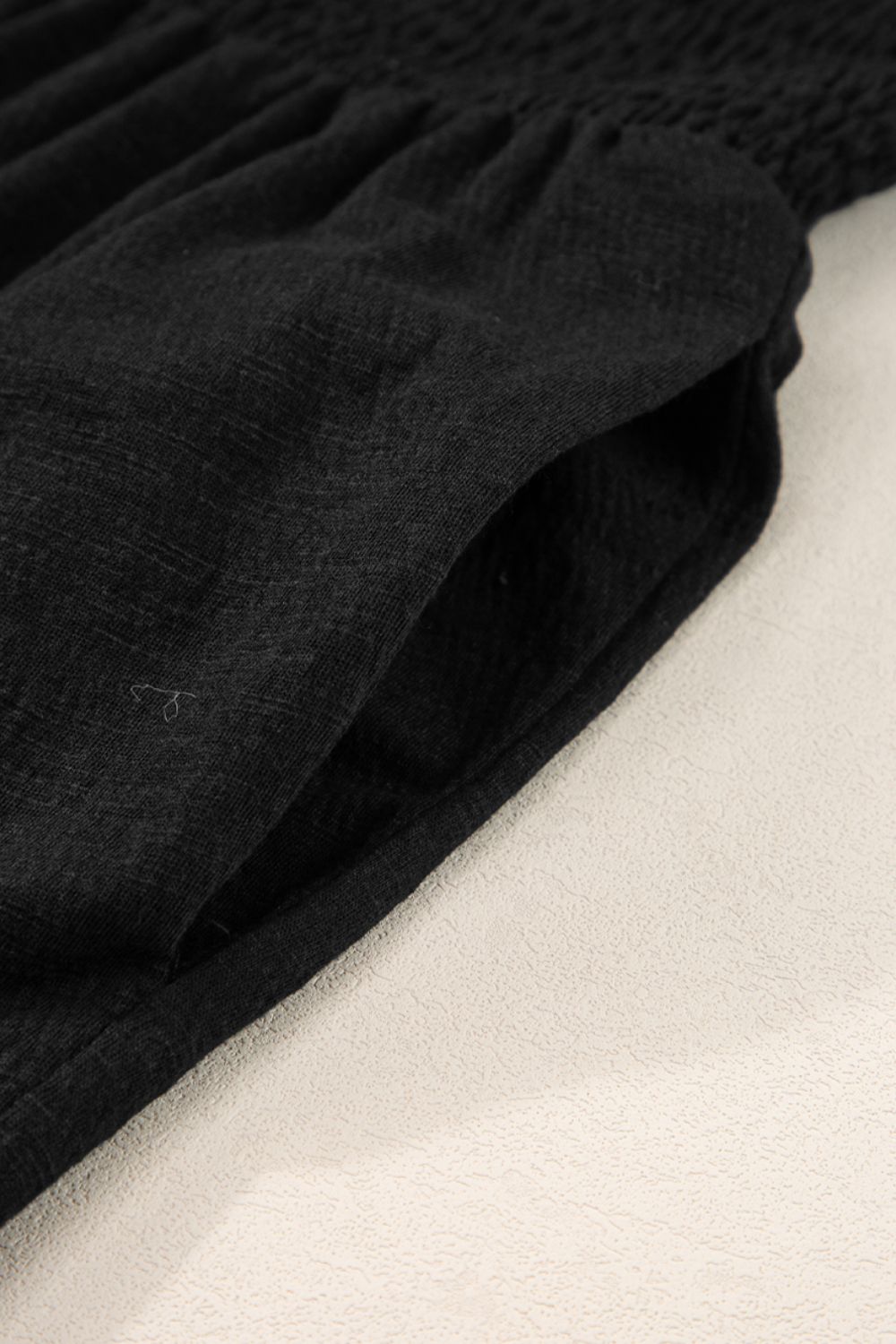 Smocked Sleeveless V Neck Jumpsuit with Pockets.