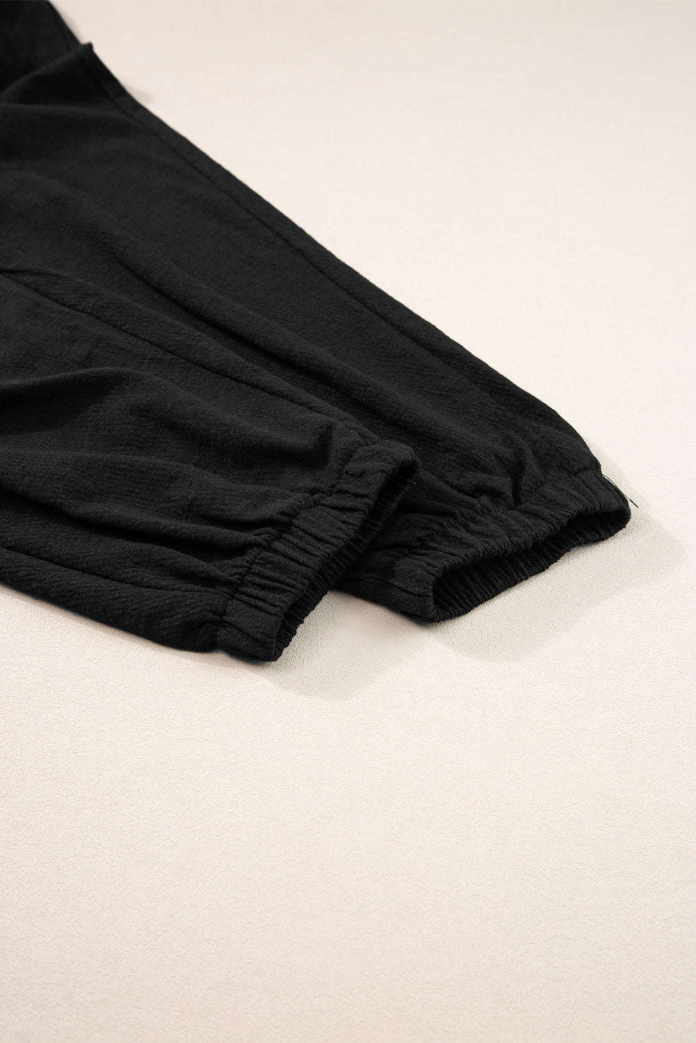 Smocked Sleeveless V Neck Jumpsuit with Pockets.