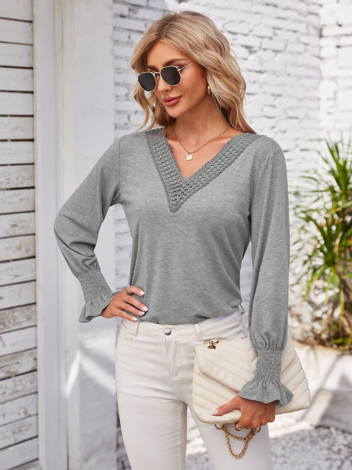 Smocked V-Neck Long Sleeve Blouse.