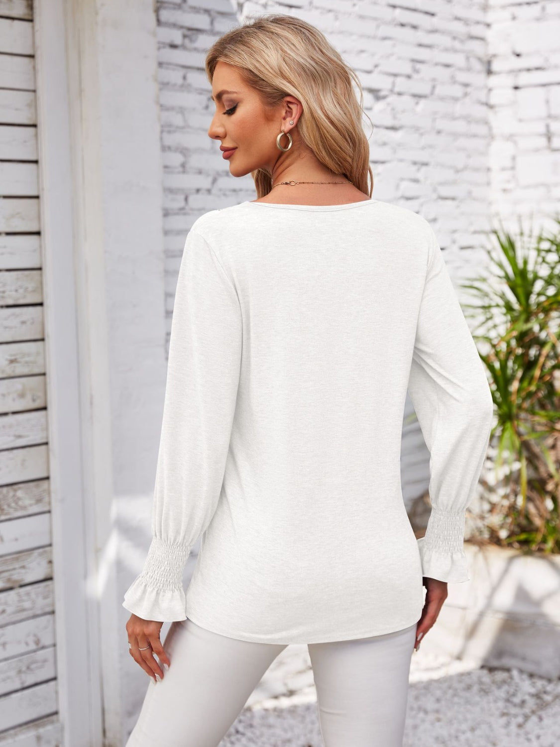 Smocked V-Neck Long Sleeve Blouse.