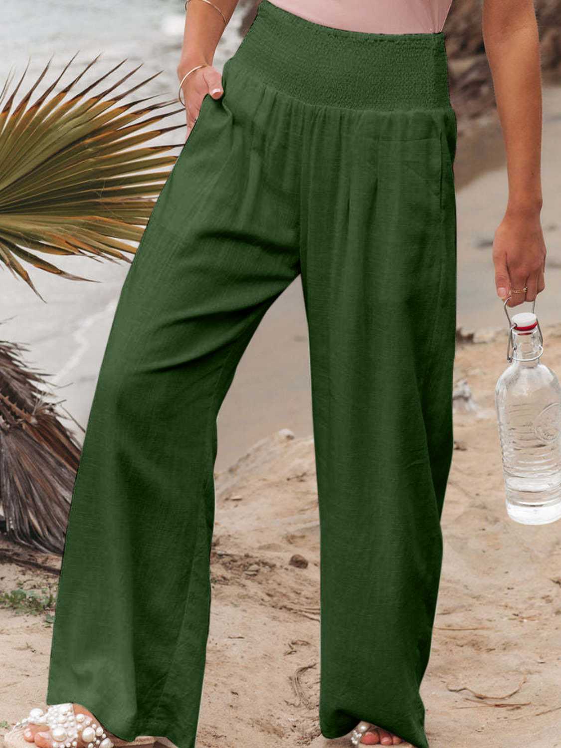 Smocked waist wide leg pants with pockets, opaque.