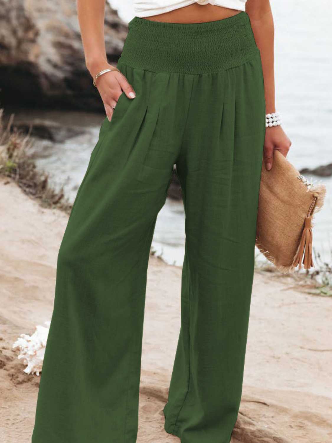 Smocked waist wide leg pants with pockets, opaque.