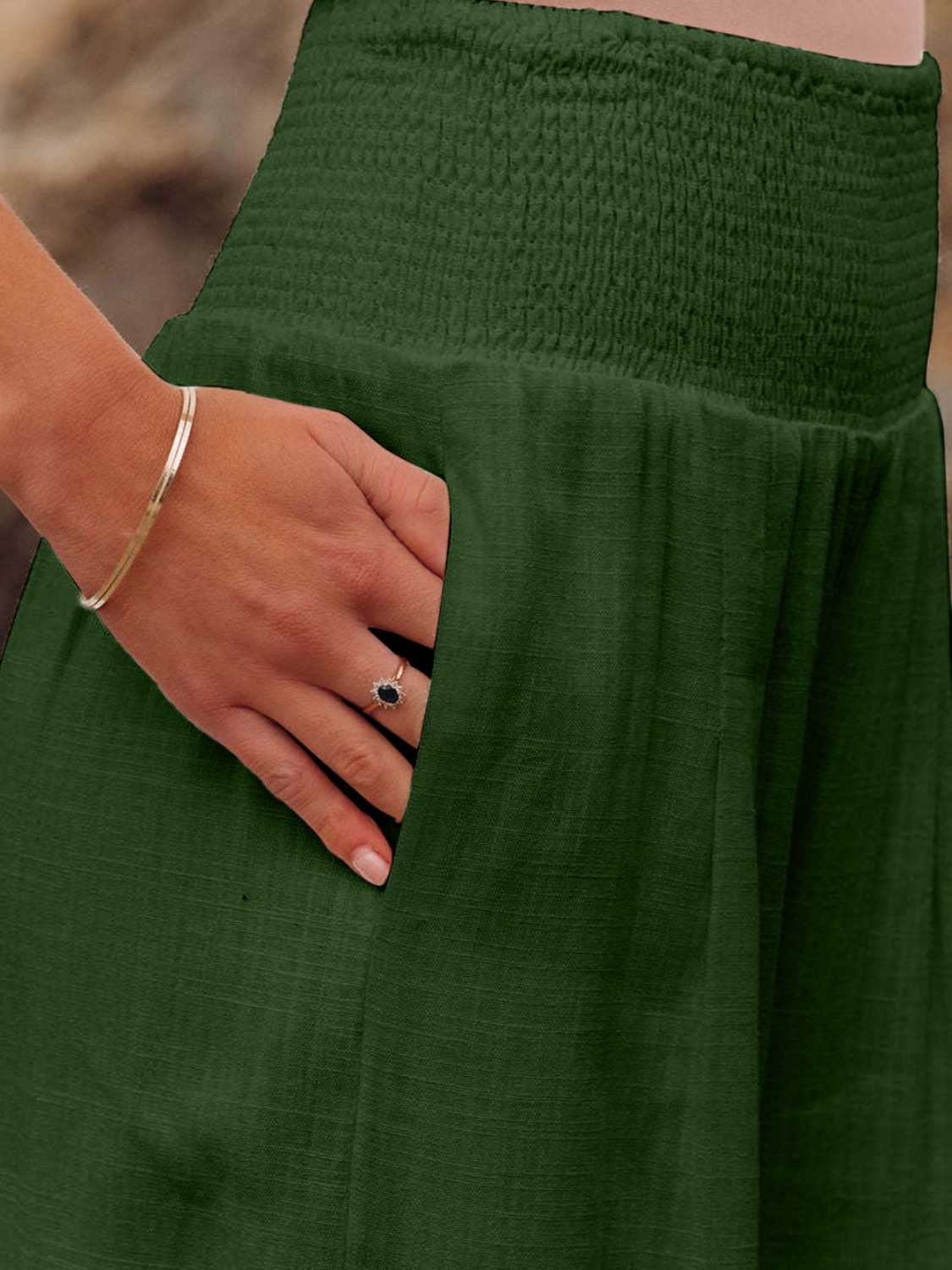Smocked waist wide leg pants with pockets, opaque.
