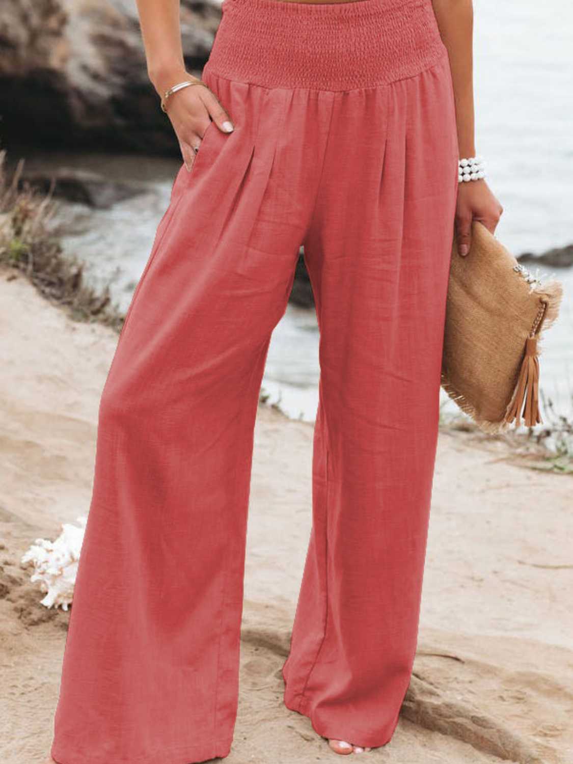 Smocked waist wide leg pants with pockets, opaque.