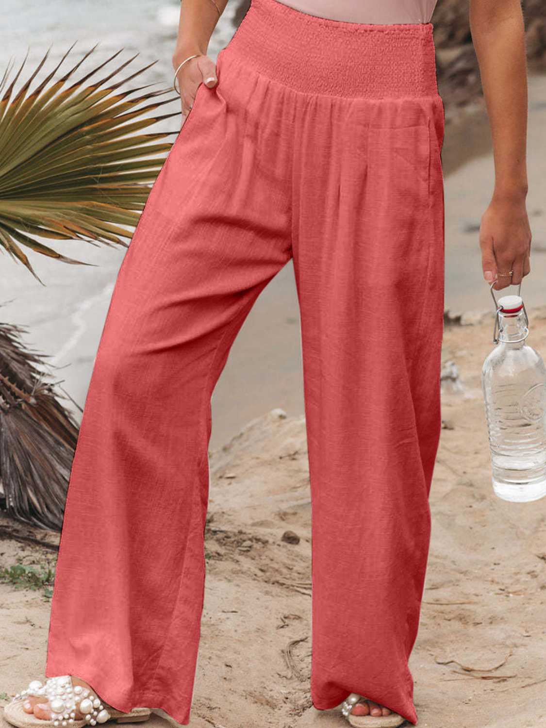 Smocked waist wide leg pants with pockets, opaque.