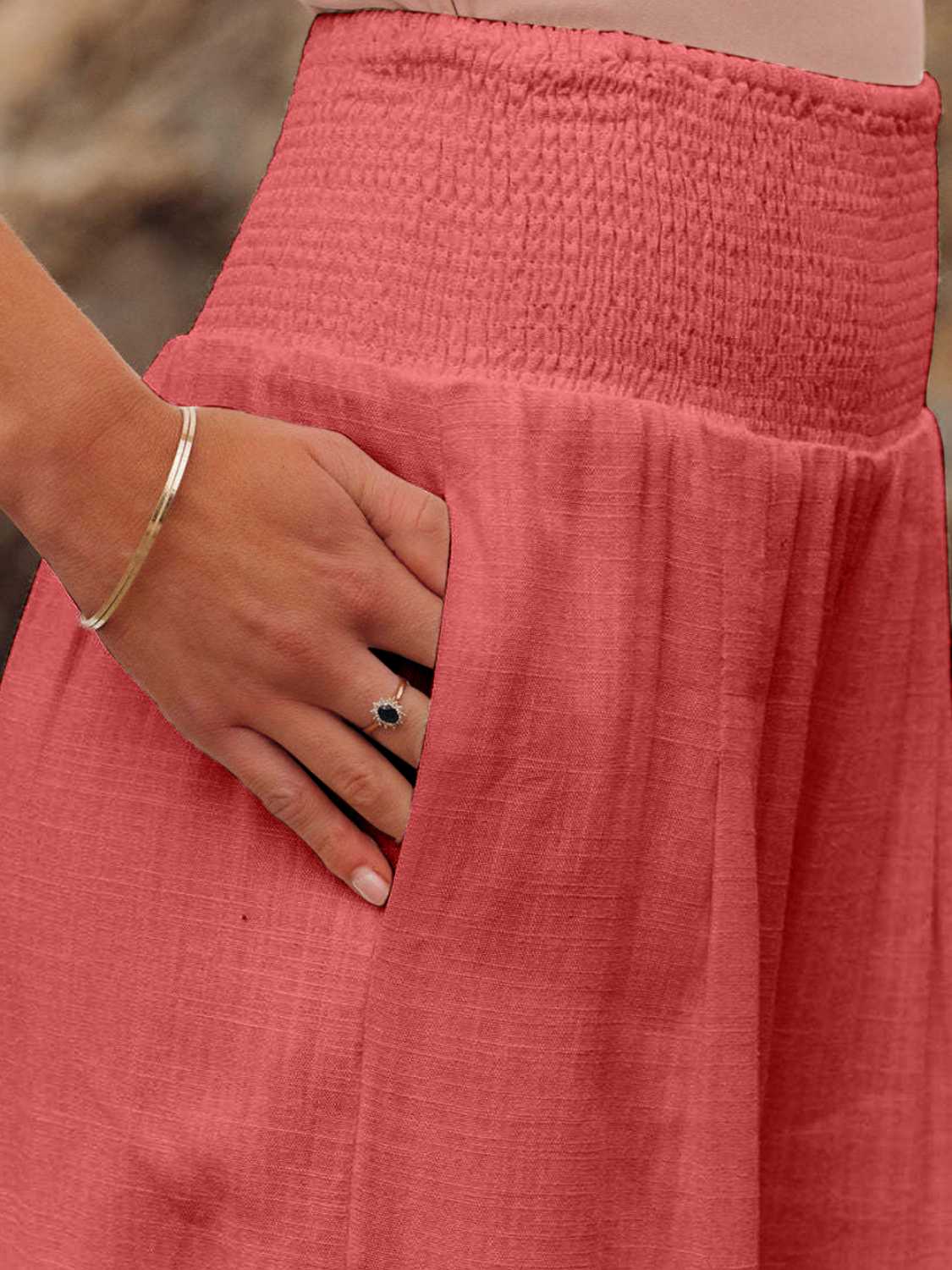 Smocked waist wide leg pants with pockets, opaque.