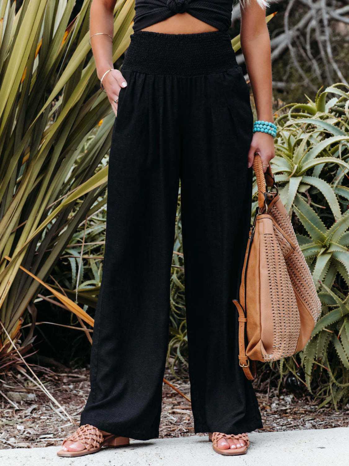 Smocked waist wide leg pants with pockets, opaque.