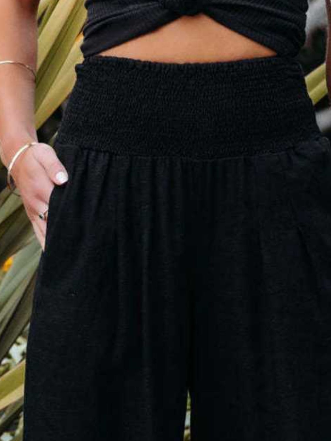 Smocked waist wide leg pants with pockets, opaque.