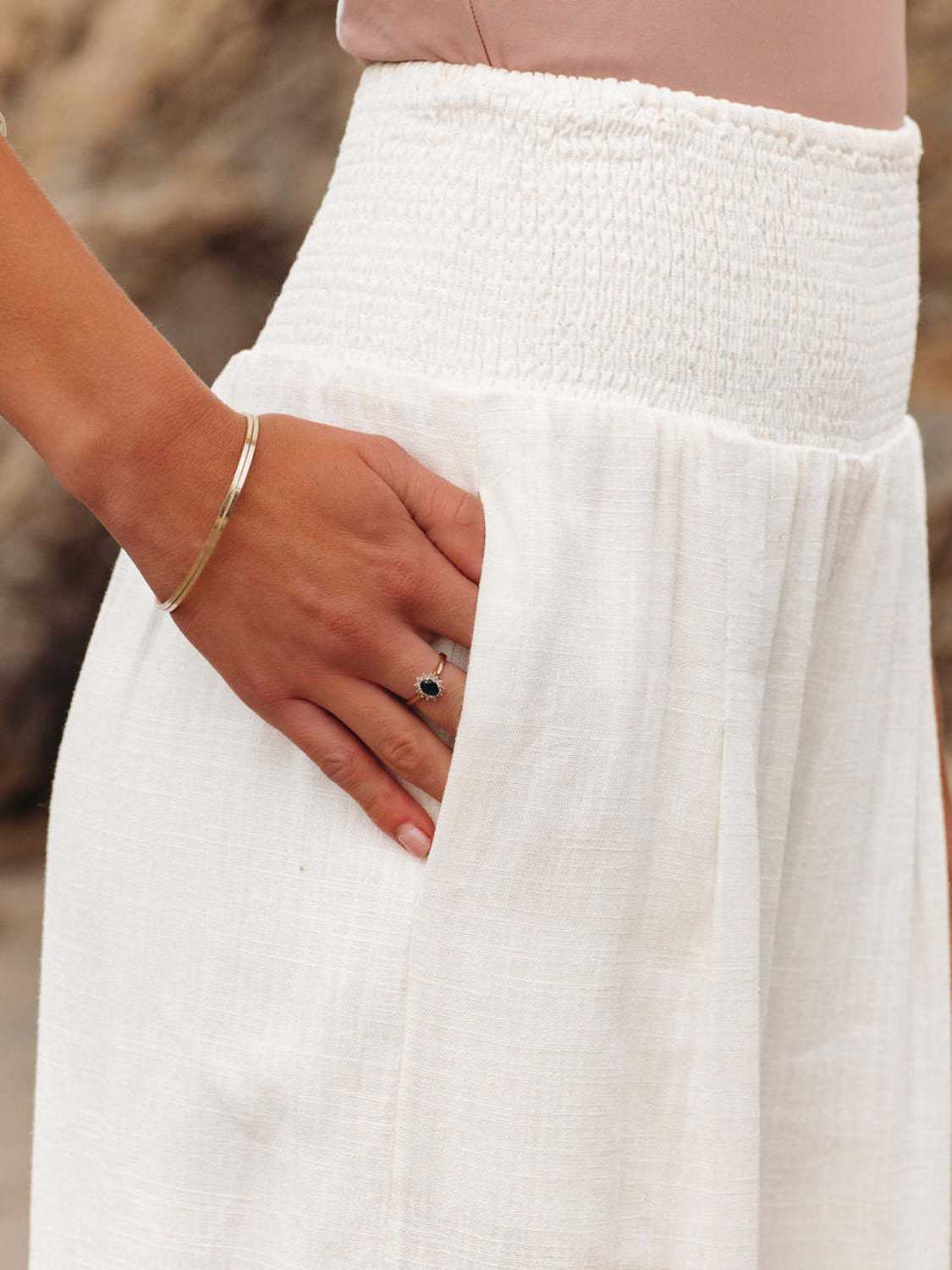 Smocked waist wide leg pants with pockets, opaque.