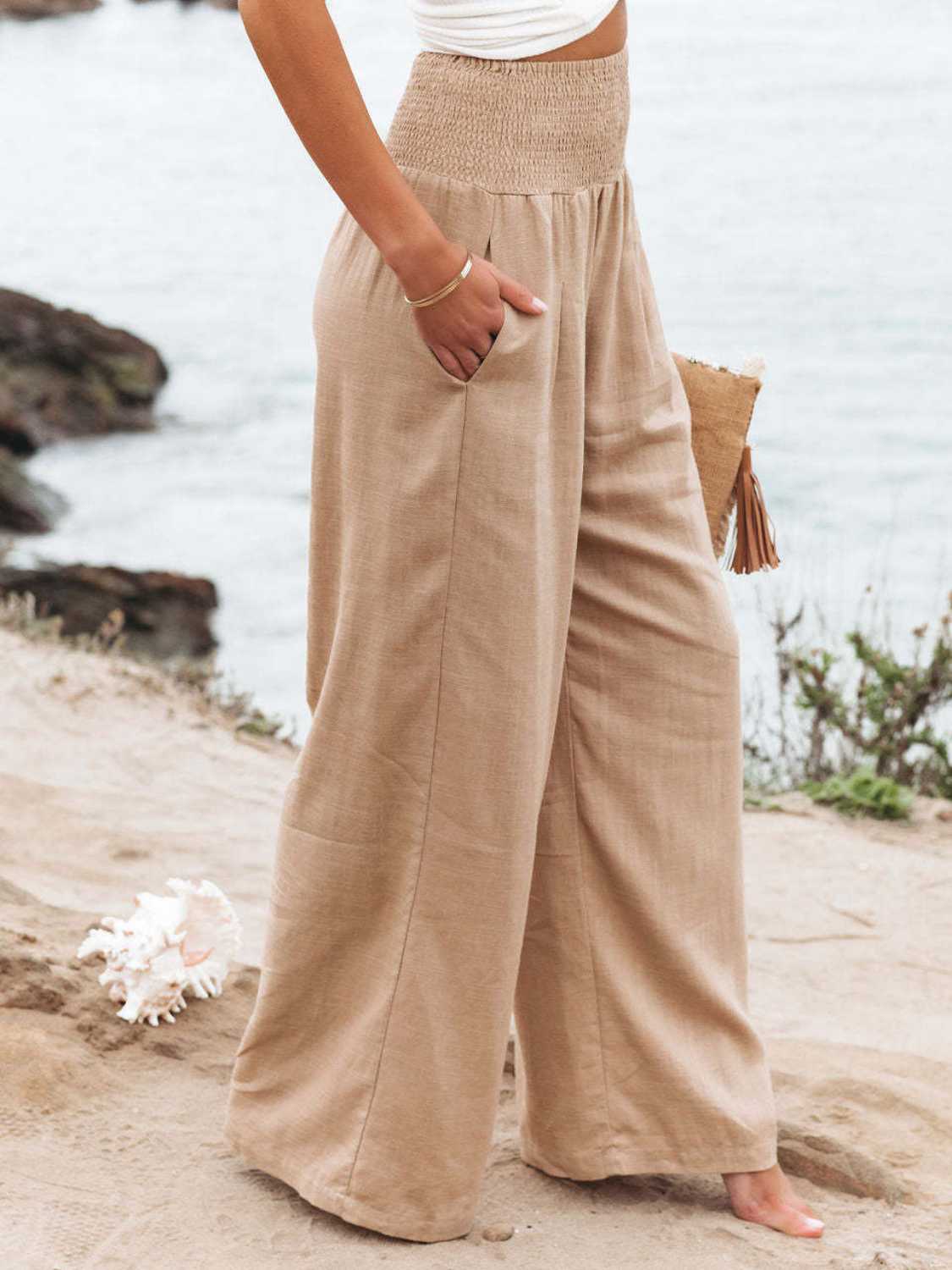Smocked waist wide leg pants with pockets, opaque.