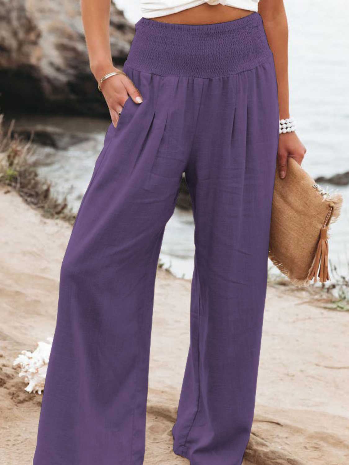 Smocked waist wide leg pants with pockets, opaque.
