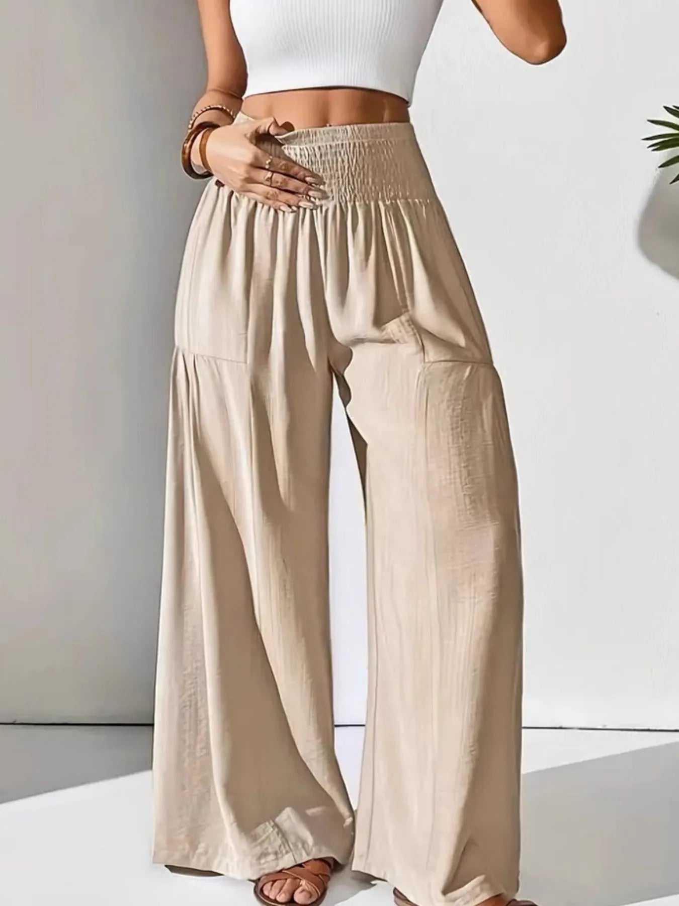 Smocked waist wide leg pants with pockets.