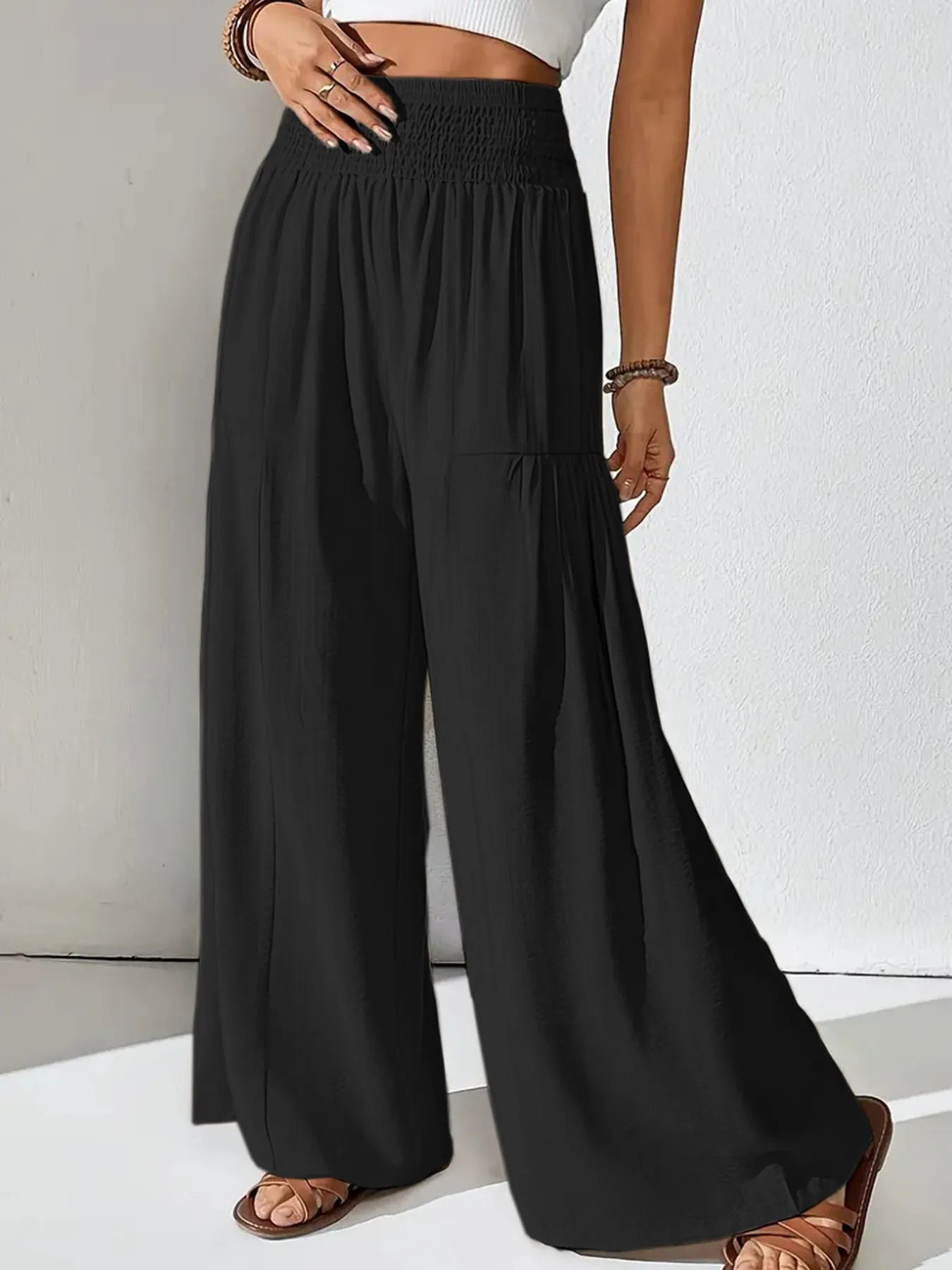 Smocked waist wide leg pants with pockets.