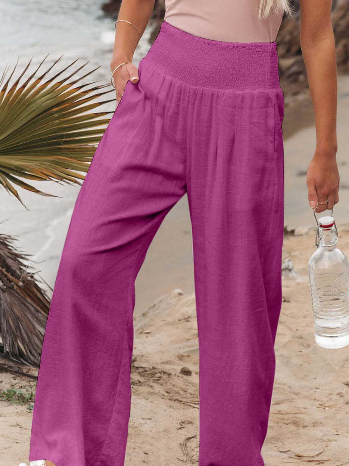Smocked waist wide leg pants with pockets, opaque.
