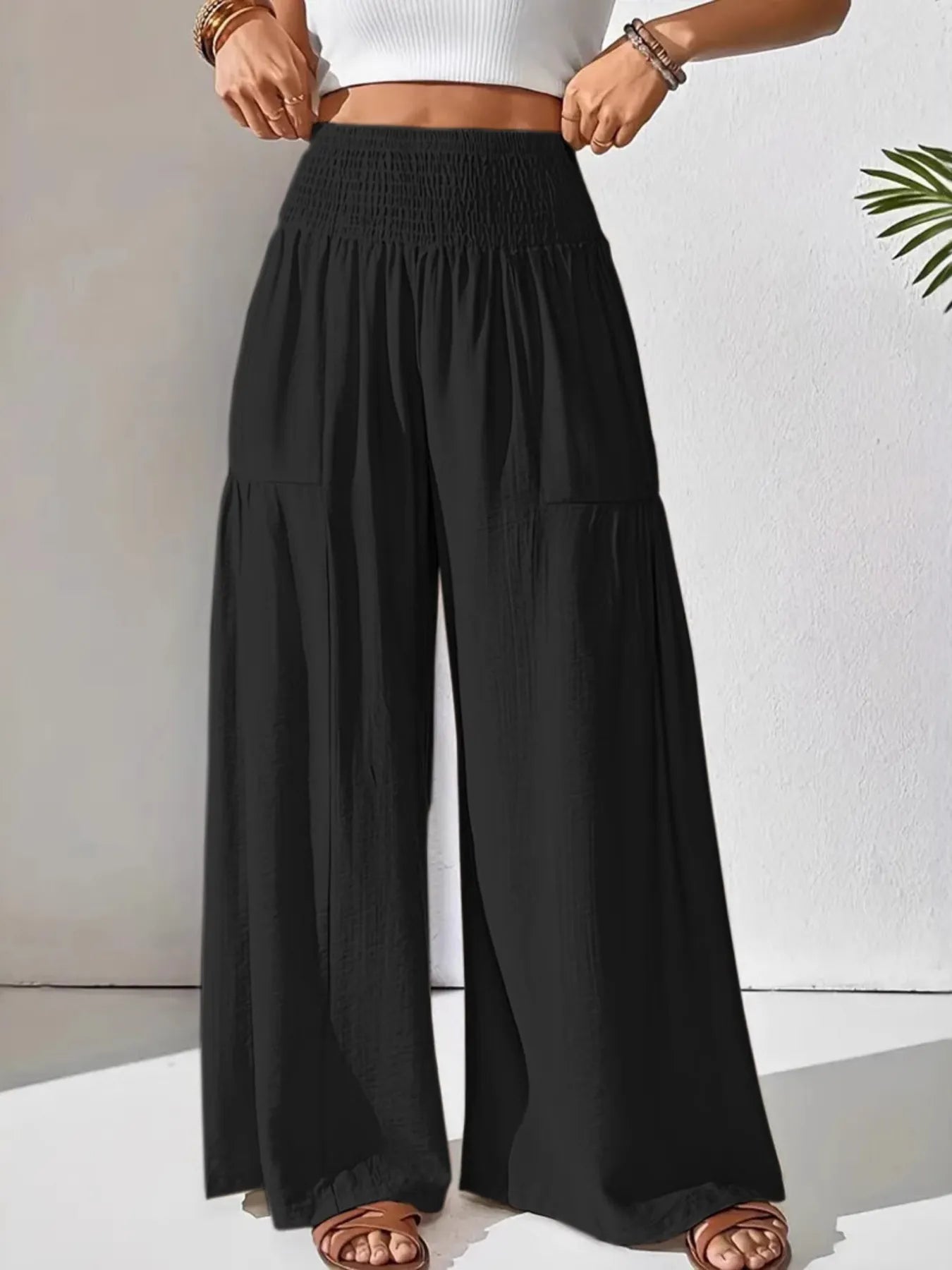Smocked waist wide leg pants with pockets.