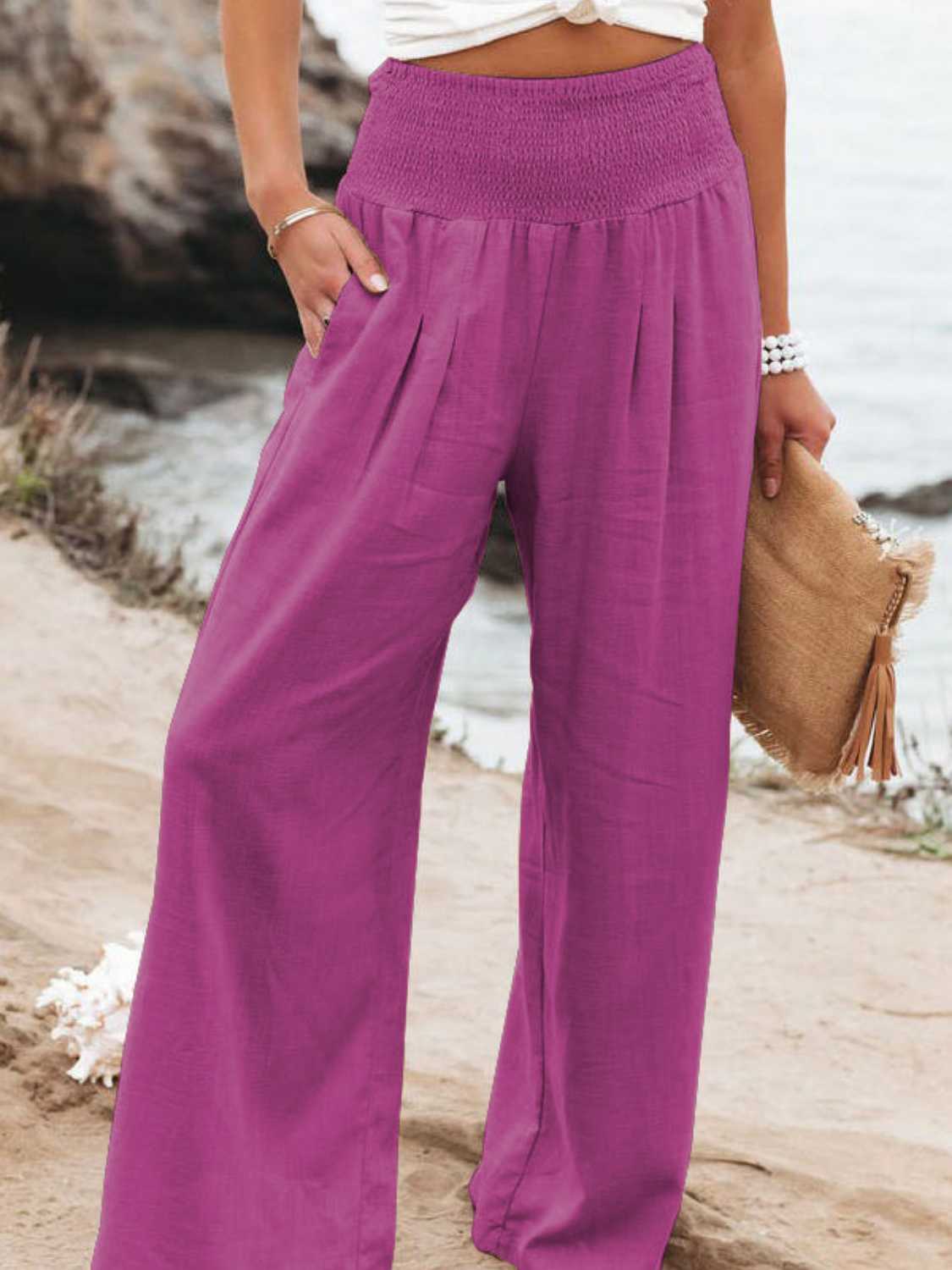 Smocked waist wide leg pants with pockets, opaque.