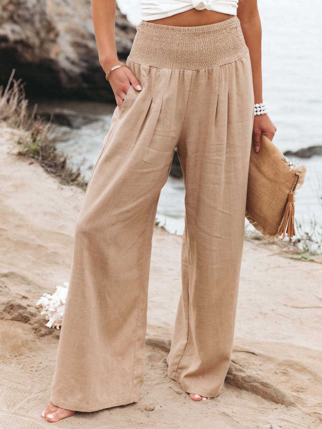 Smocked waist wide leg pants with pockets, opaque.