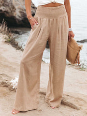 Smocked waist wide leg pants with pockets, opaque.