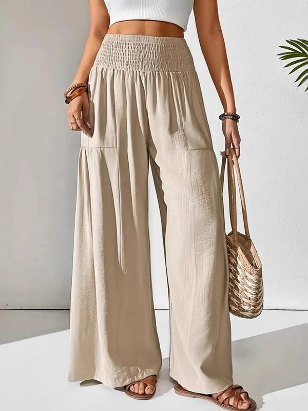 Smocked waist wide leg pants with pockets.
