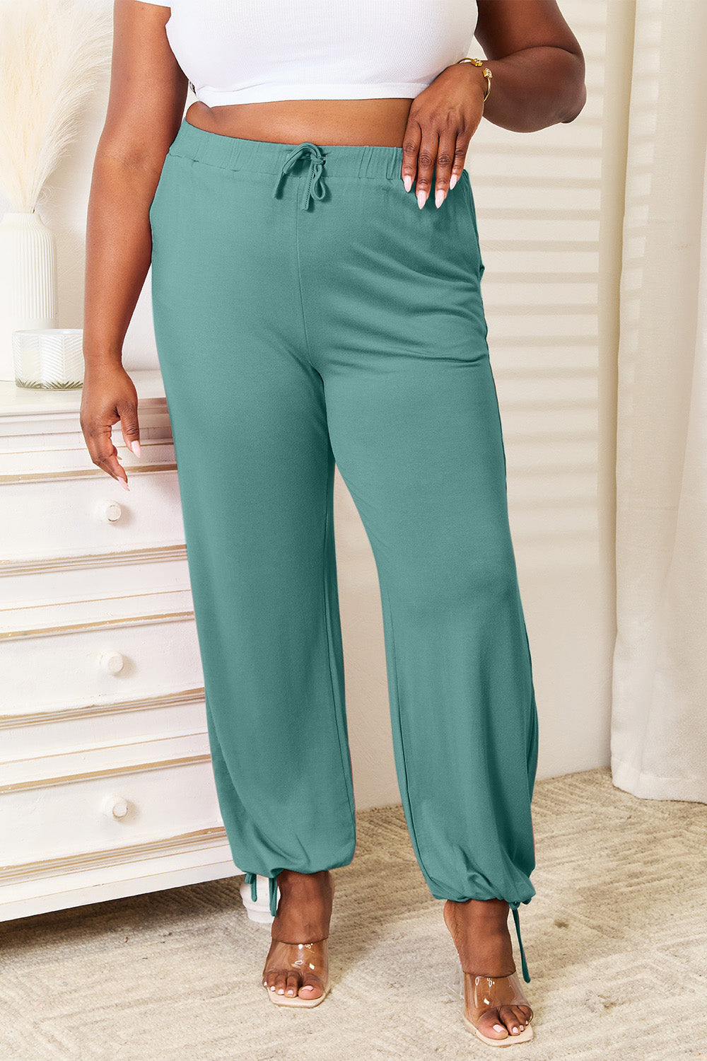 Soft rayon drawstring waist pants with pockets, opaque.