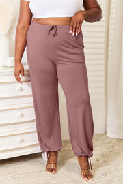 Soft rayon drawstring waist pants with pockets, opaque.