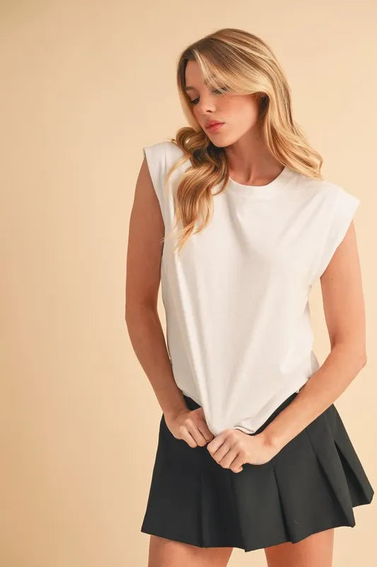 Solid color round neck tank, slightly stretchy.