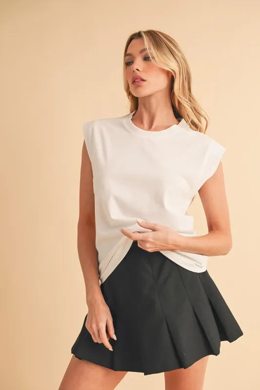 Solid color round neck tank, slightly stretchy.