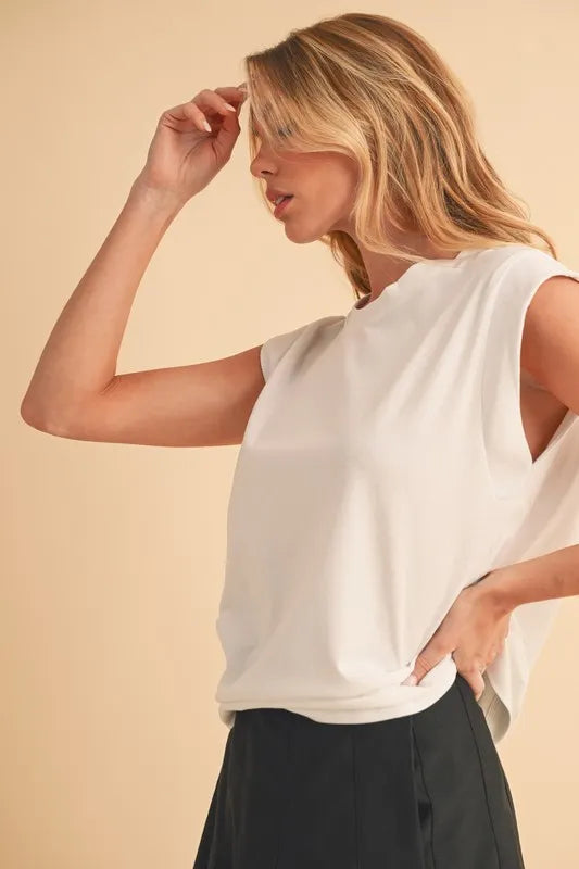 Solid color round neck tank, slightly stretchy.