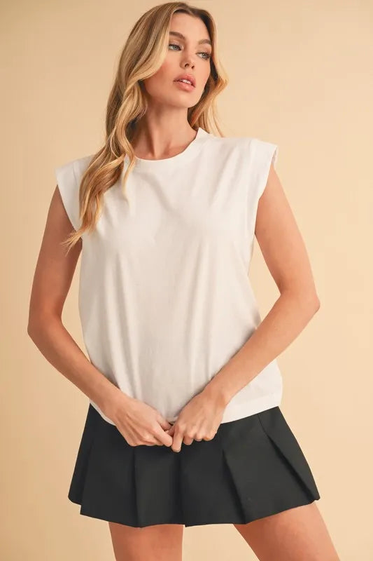 Solid color round neck tank, slightly stretchy.
