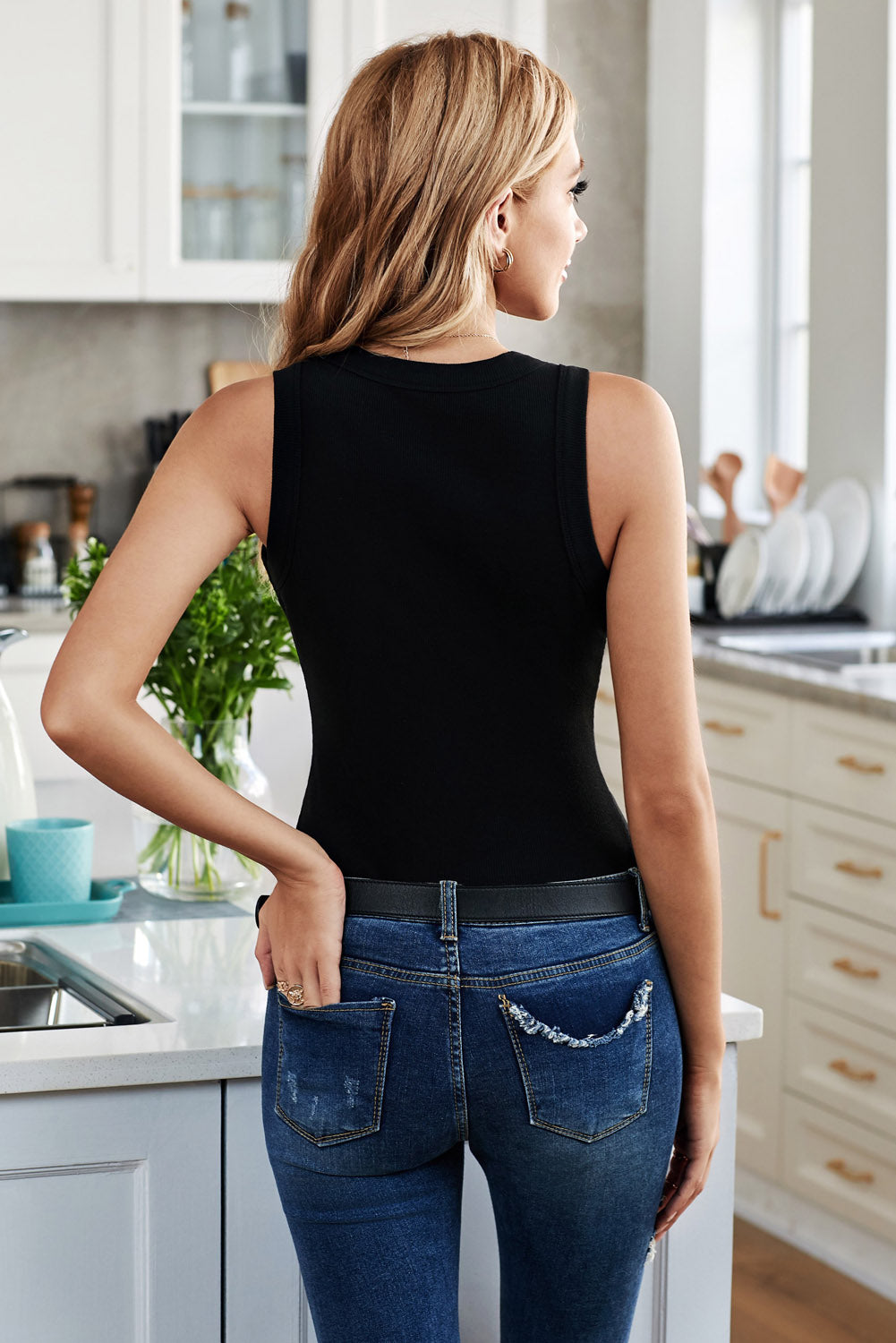 Solid round neck tank, opaque and slightly stretchy.