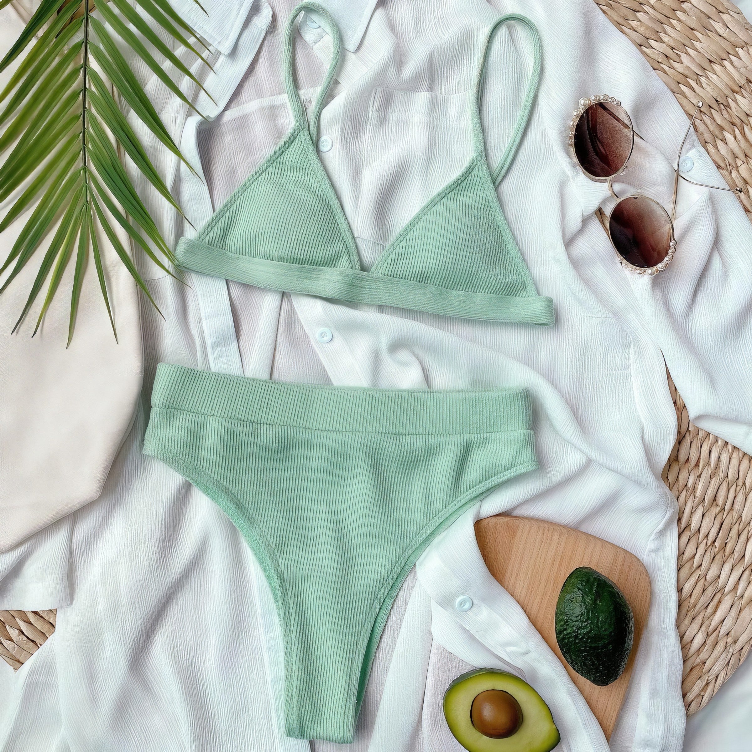 Solid ribbed spaghetti strap bikini set with mid-waist bottoms.