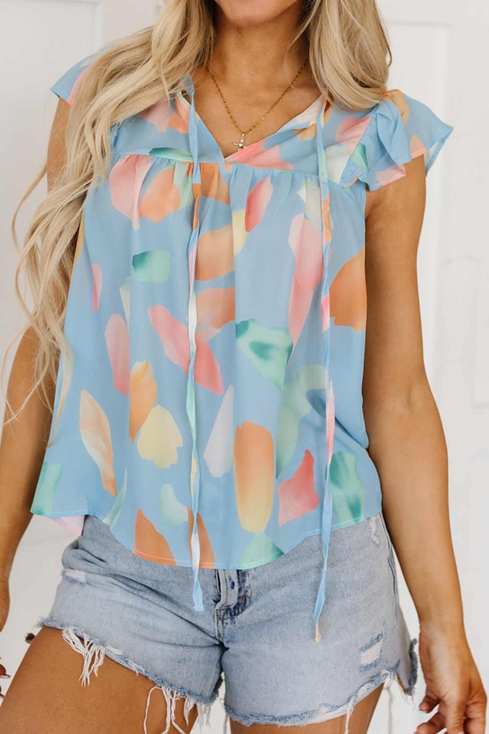 Splotches Pattern Ruffled Cap Sleeve Blouse.