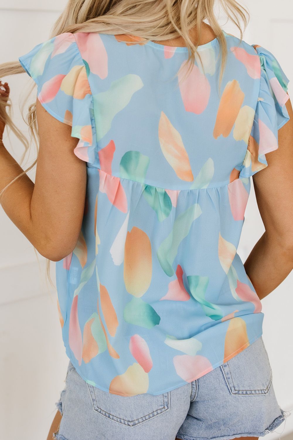 Splotches Pattern Ruffled Cap Sleeve Blouse.