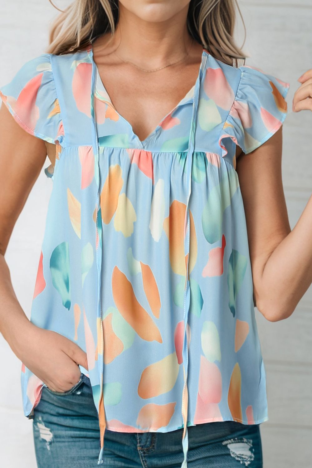 Splotches Pattern Ruffled Cap Sleeve Blouse.