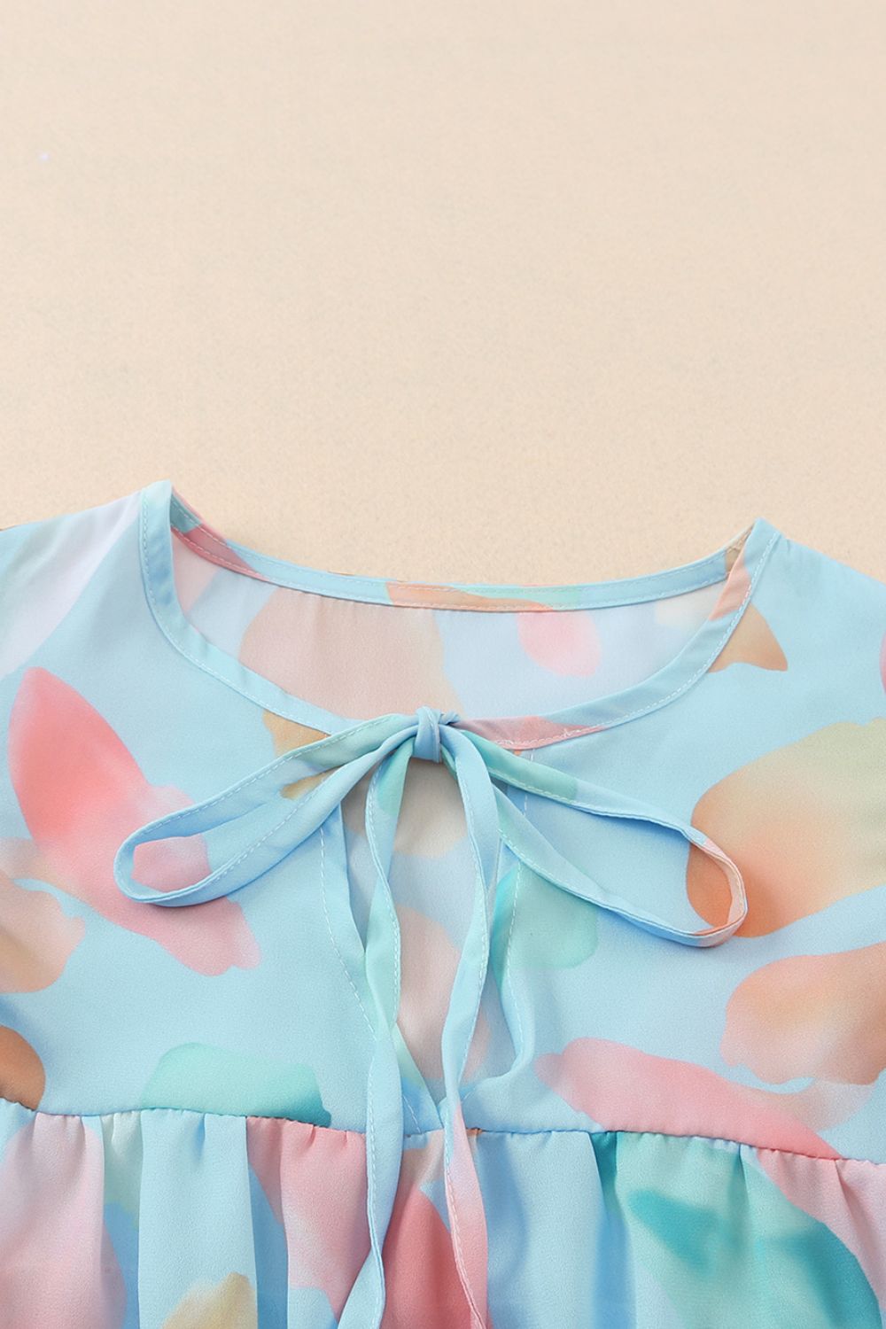 Splotches Pattern Ruffled Cap Sleeve Blouse.